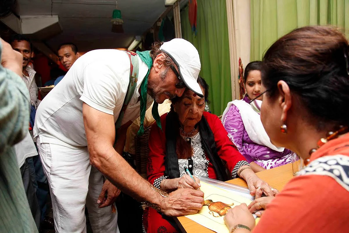 Jackie Shroff getting an autograph from Usha R Khanna on the Cafe Samovar menu card (Photo: Yogen Shah)