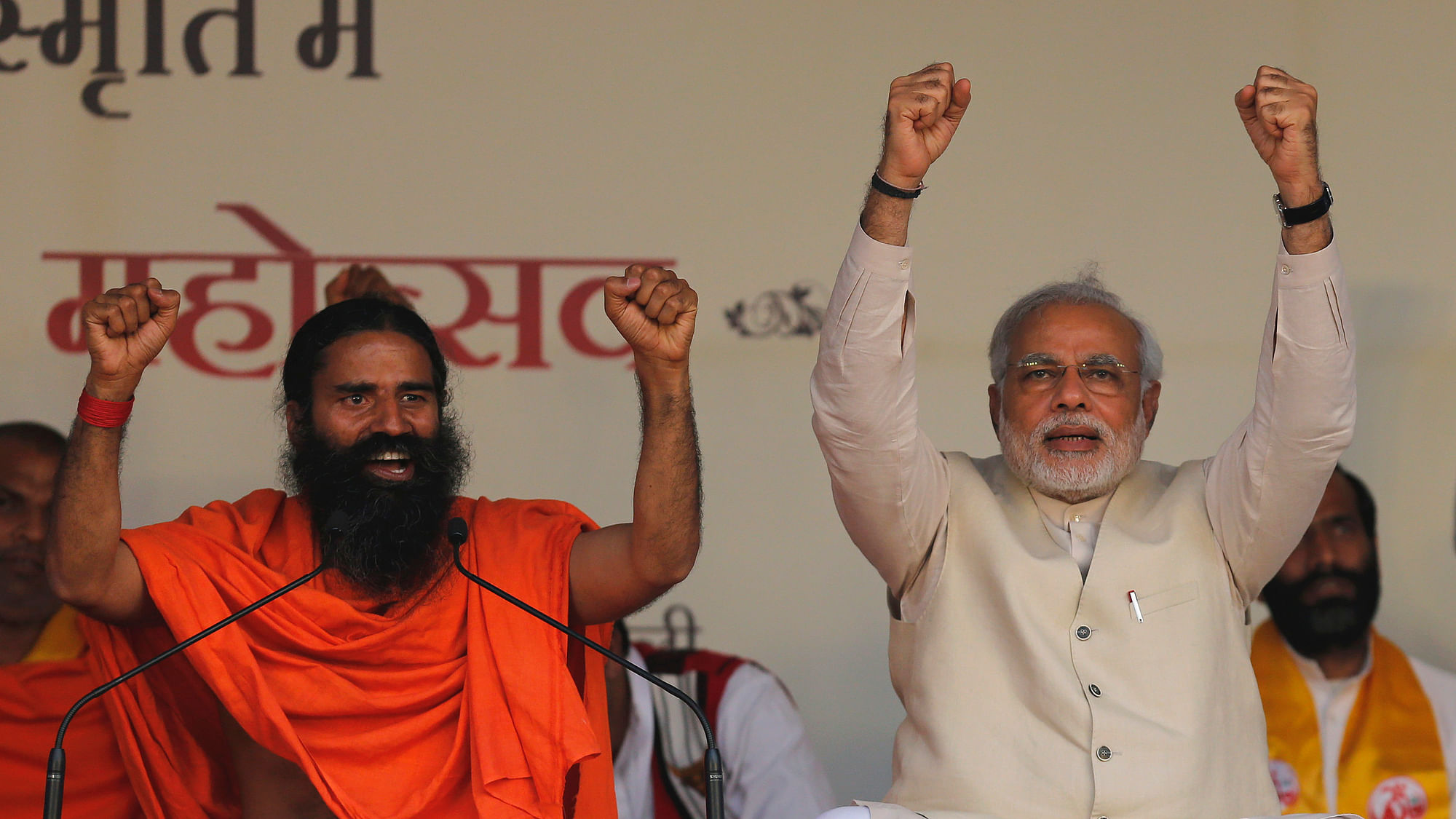 Baba Ramdev (L) with Prime Minister Narendra Modi (R) at a Yoga Festival in New Delhi. (Photo: Reuters)