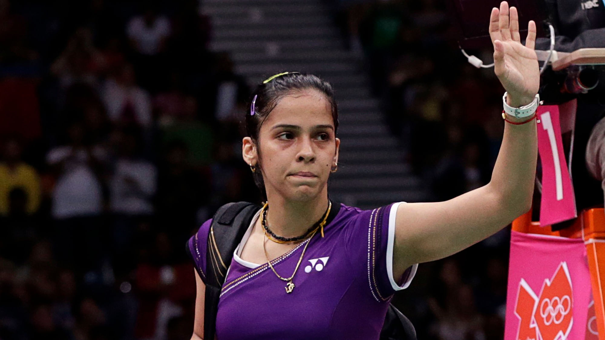 Indian shuttler Saina Nehwal crashed out in the second round of Thailand Open after being stunned by unseeded Sayaka Takahashi of Japan.