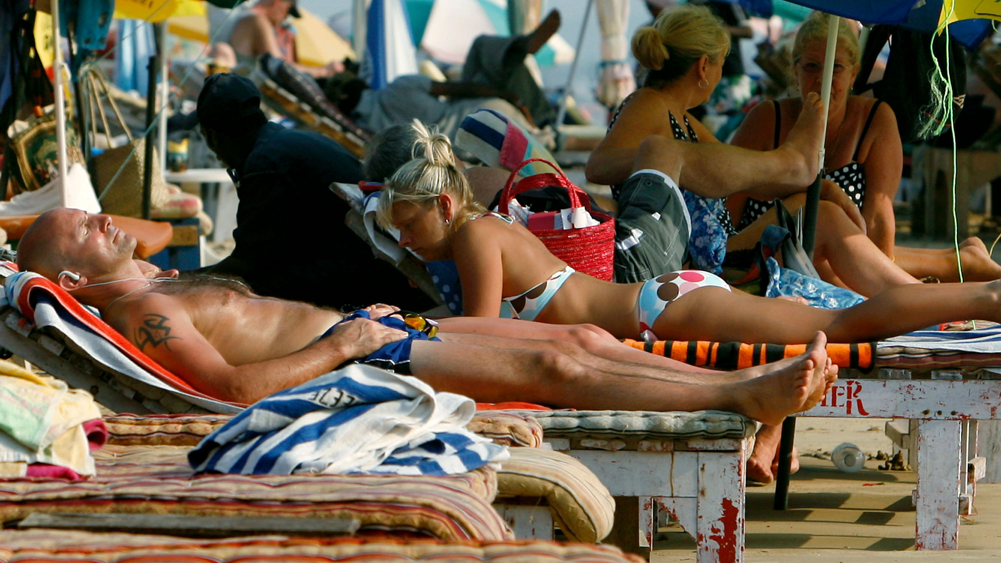

Tourists relax at  Baga beach in Goa. (Photo: Reuters)