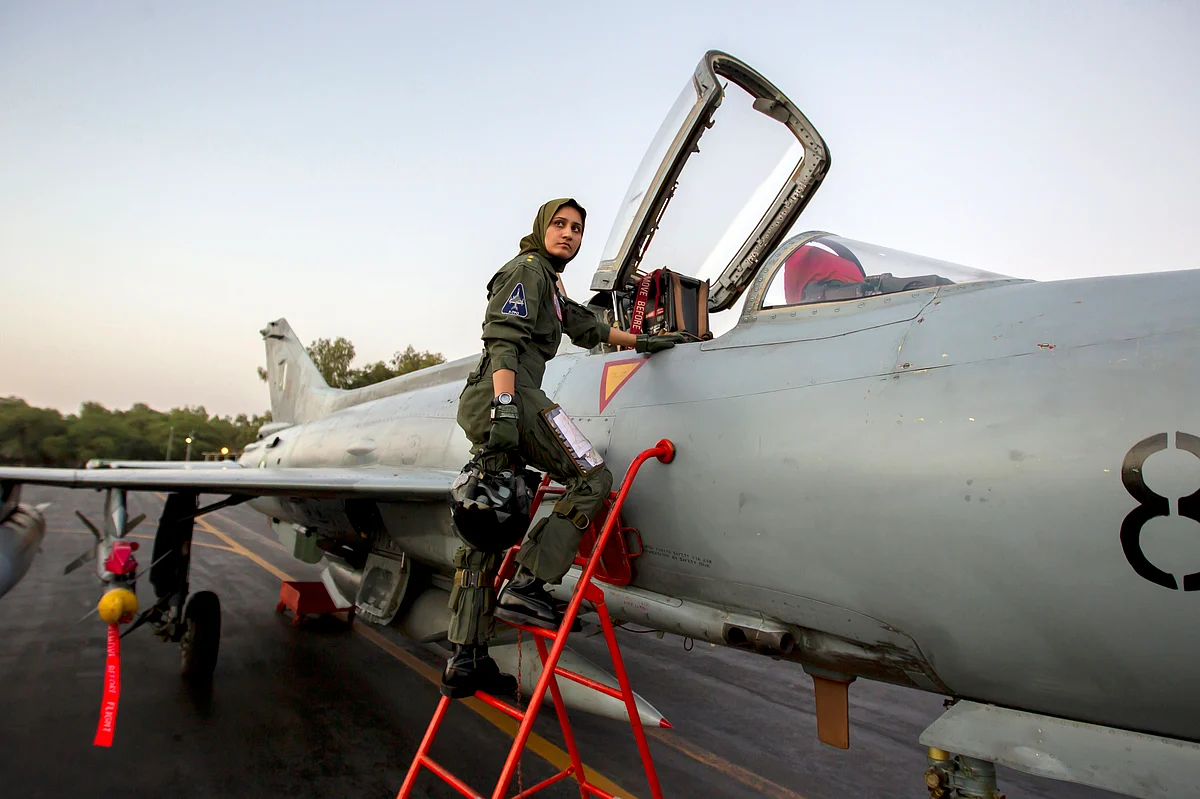 Ayesha Farooq, 26, Pakistan’s only female war-ready fighter pilot, climbs up to a Chinese-made F-7PG fighter jet at Mushaf base in Sargodha, north Pakistan, June 6, 2013. (Photo: Reuters)<!--EndFragment-->