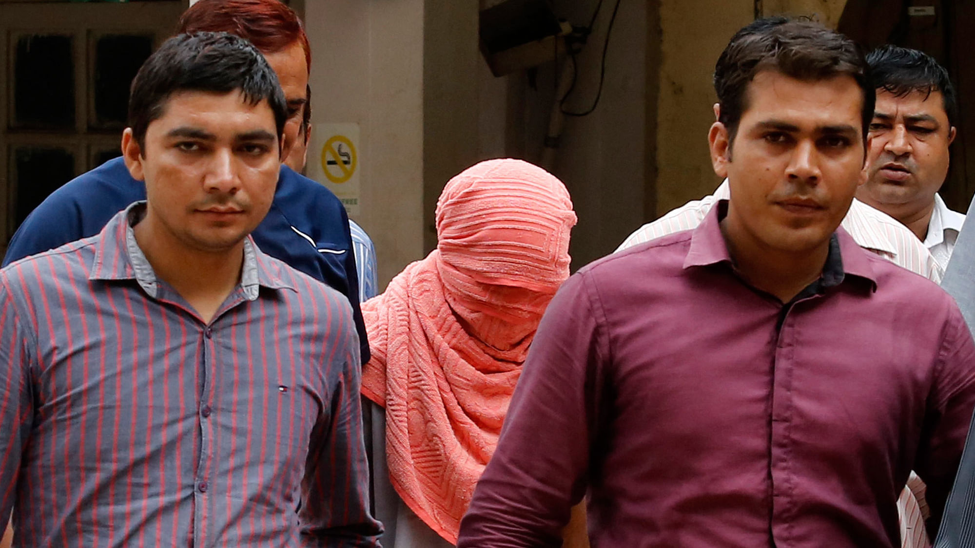 Policemen escort the juvenile convicted in the December gangrape case of 2012. (Photo: Reuters)