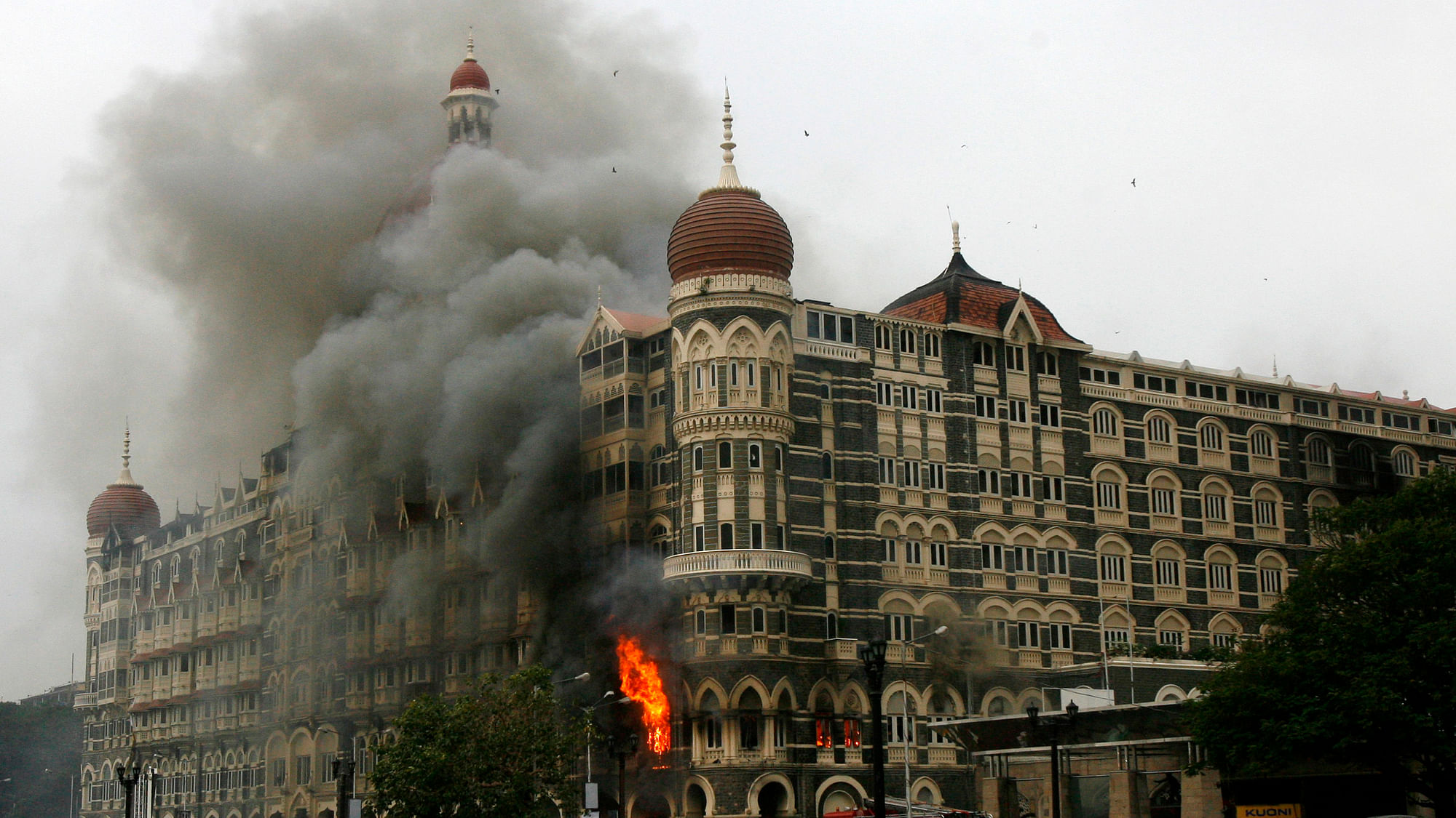 The Taj Mahal hotel is seen engulfed in smoke during a gun battle in Mumbai, November 2008. (Photo: Reuters)