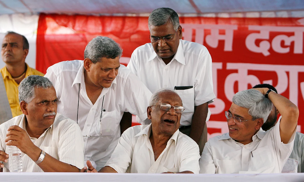 (Left to Right) Senior communist leaders Debabrata Biswas, Sitaram Yechury, AB Bardhan, D Raja (standing) and Prakash Karat. (Photo: Reuters/Adnan Abidi)