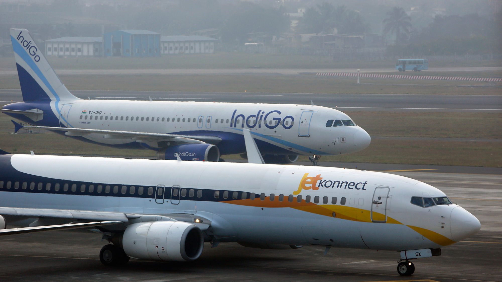 An IndiGo Airlines Airbust A320 aircraft and JetKonnect  Boeing 737 aircraft taxi at Mumbai’s Chhatrapathi Shivaji International Airport.