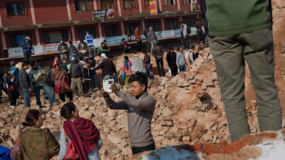 A man takes a selfie at the historic Dharahara Tower, a city landmark, that was damaged in Saturday’s earthquake in Kathmandu, Nepal, Monday, April 27, 2015. (Photo: AP)