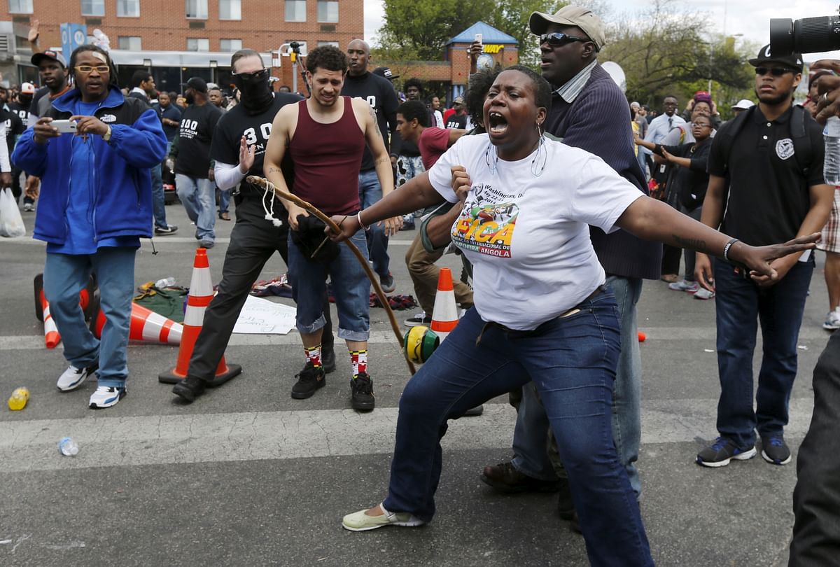  Powerful photos from the Baltimore riots speak volumes about the scene on ground.