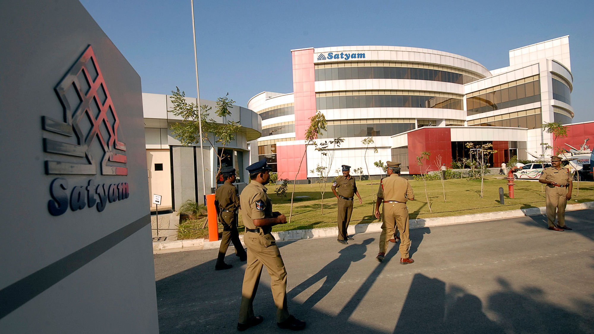 Policemen walk inside the Satyam Computer Services head office in the southern Indian city of Hyderabad 12 January 2009