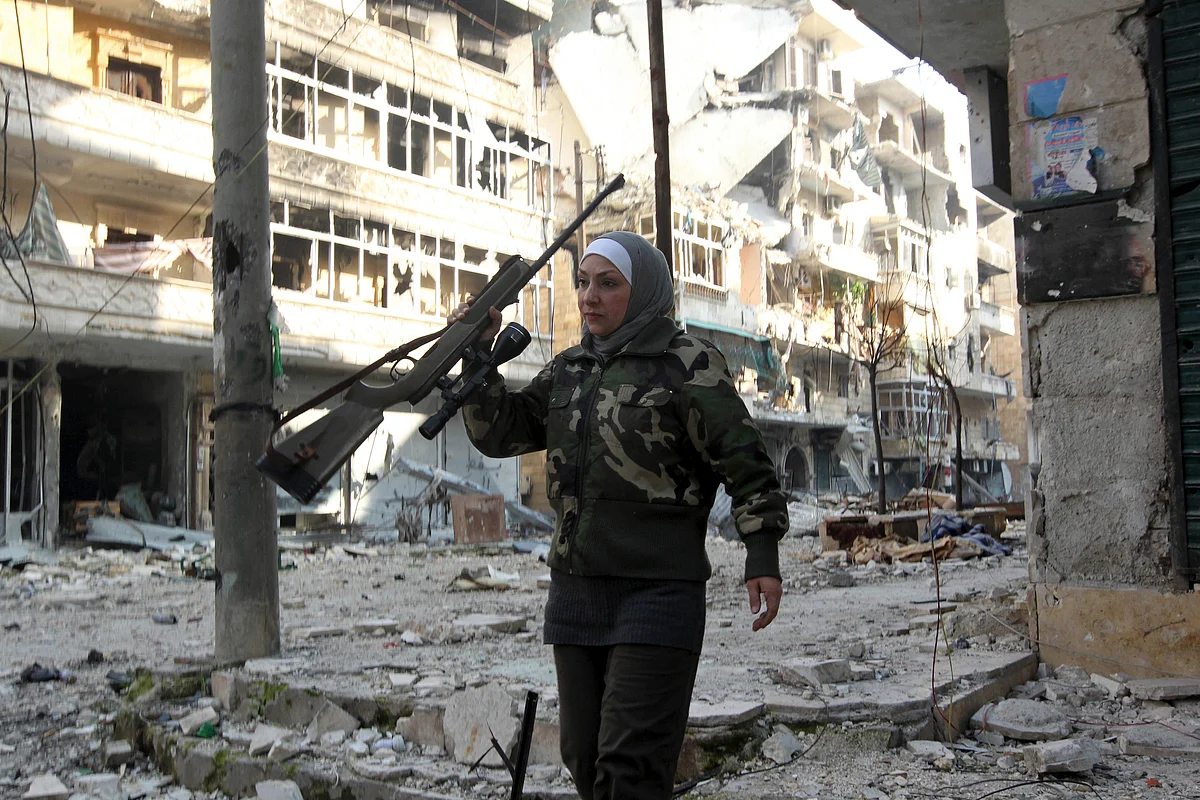 Guevara, a Syrian Palestinian woman married to an Al Wa’ad battalion commander, is pictured in Aleppo, January 19, 2013. Guevara was the director of a secondary school before the revolution and is now one of the main snipers of the battalion on the front line in Aleppo. (Photo: Reuters)<!--EndFragment-->