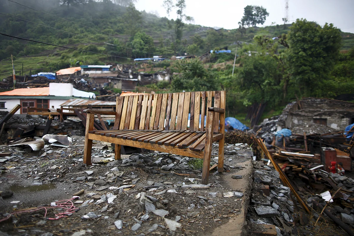 A bench is seen amidst debris of a collapsed house at Barpak village at the epicenter of the April 25 earthquake in Gorkha district, Nepal, May 21, 2015. (Photo: Reuters)