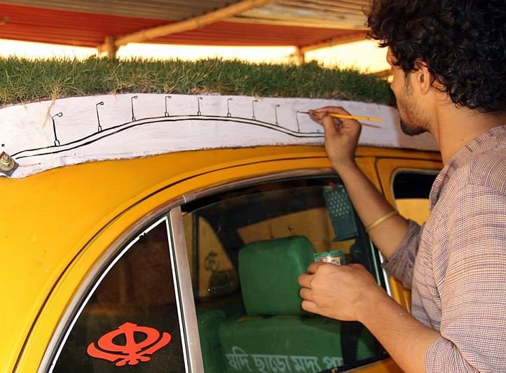 His Taxi has a roof top garden, trunk full of plants. Meet Dhananjay Chakraborty and his ‘subuj rath’. 