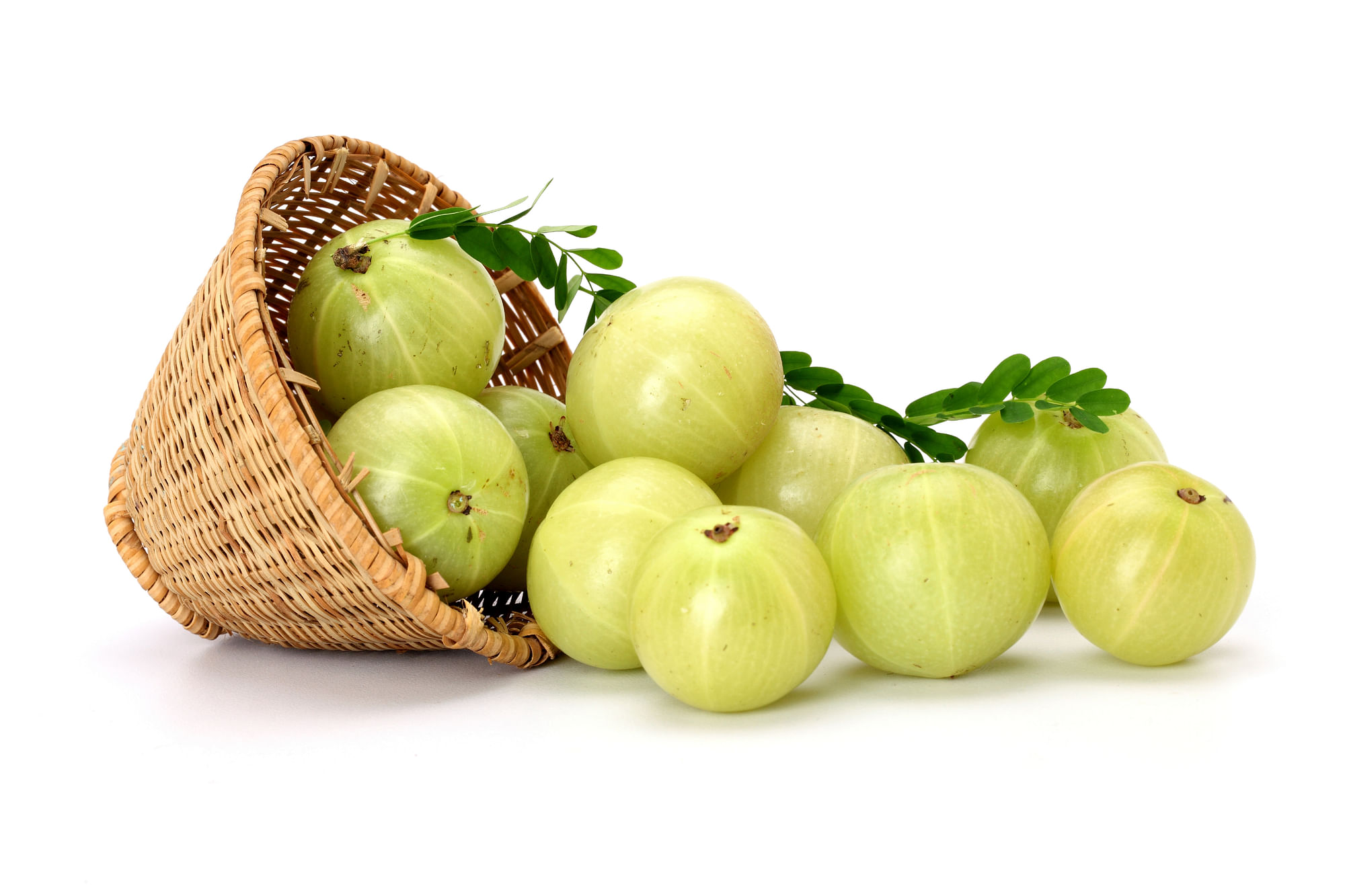 Gooseberries spilling out of a basket. (iStockphoto)