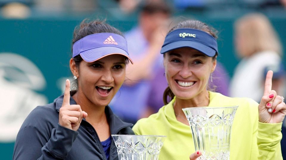 Sania Mirza (L) and Martina Hingis after the former achieved the world number one rank in doubles. (Photo: PTI)