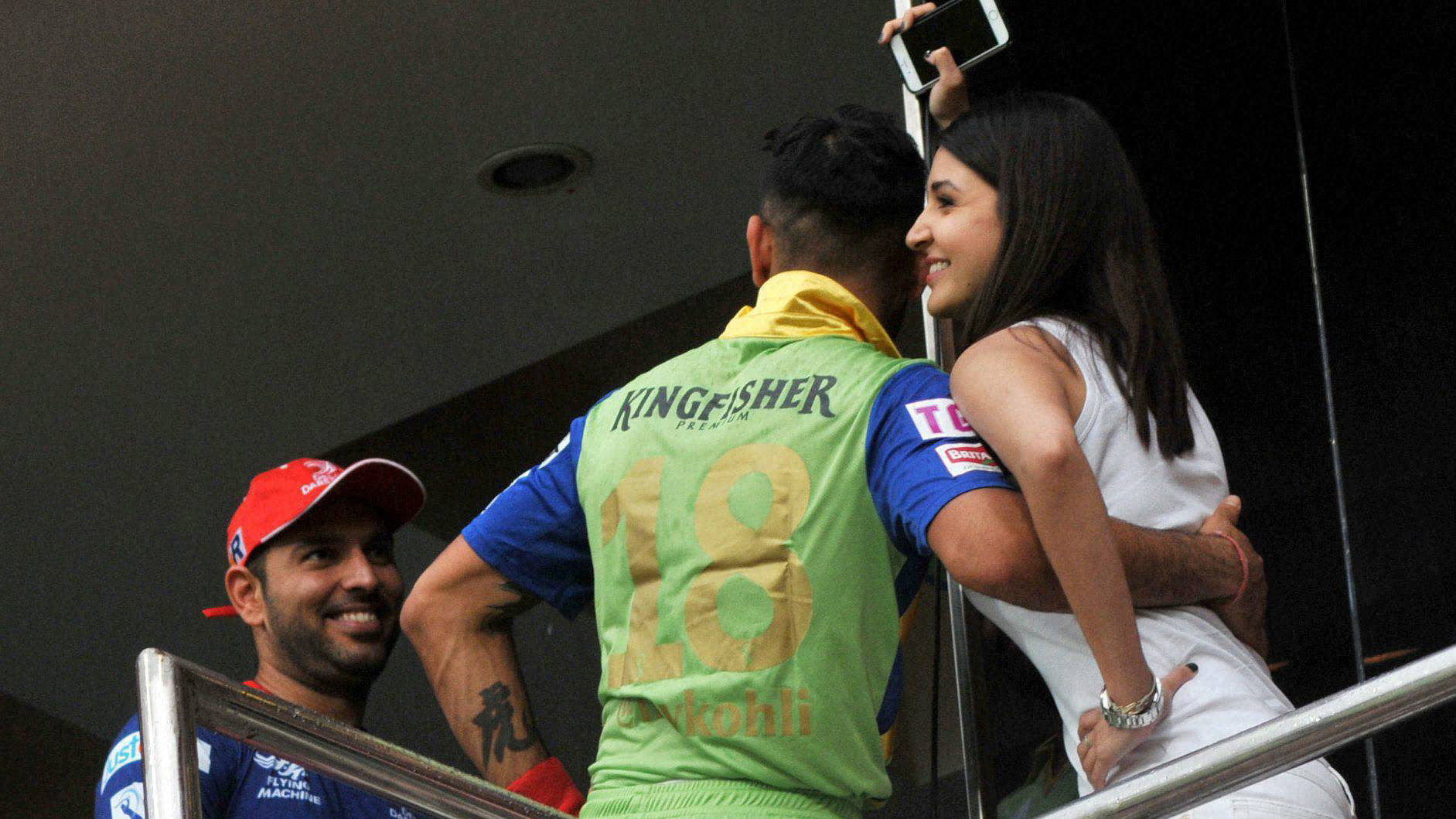 Virat Kohli and Anushkha Sharma in the stands during the IPL game between RCB and DD. (Photo: BCCI/PTI)