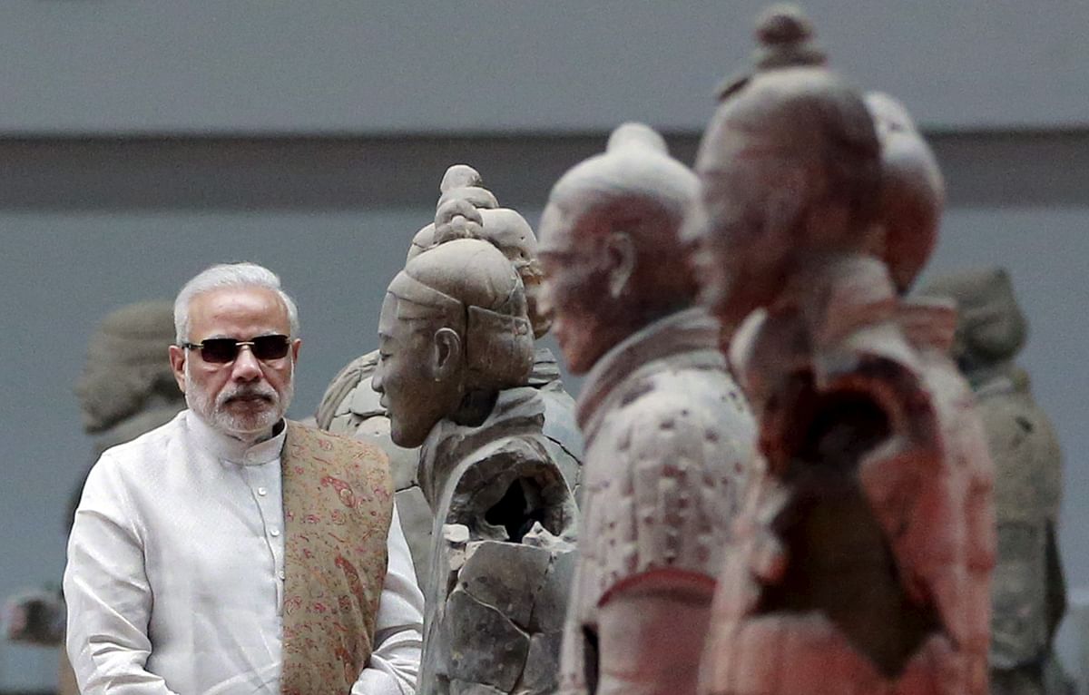 Symbolism, soft atmospherics and hard talk - PM Modi dominates Chinese media reports during his high profile visit.  