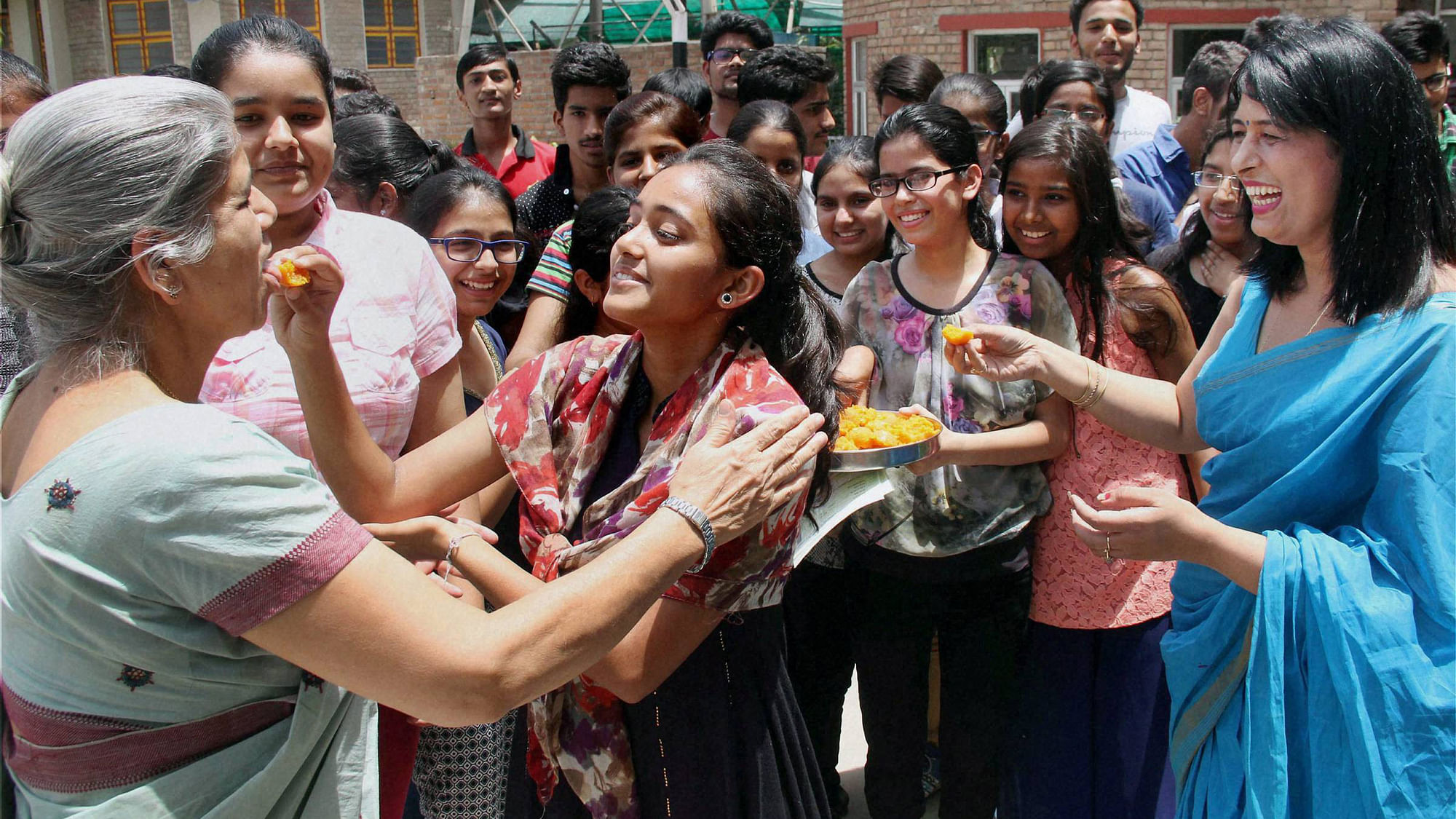 Students celebrate their success after announcement of CBSE Board Class 12th class results.