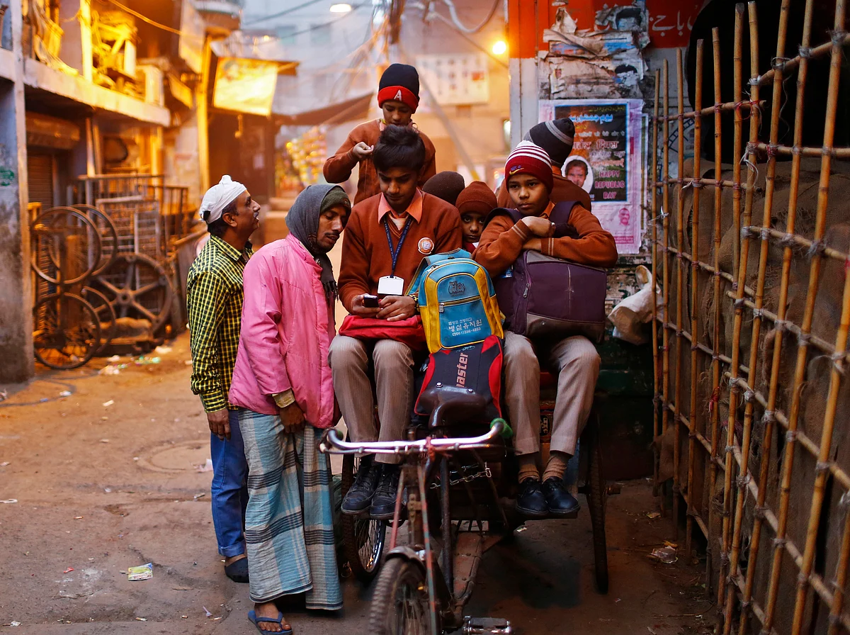 Schoolboys in a rickshaw. (Photo: Reuters)