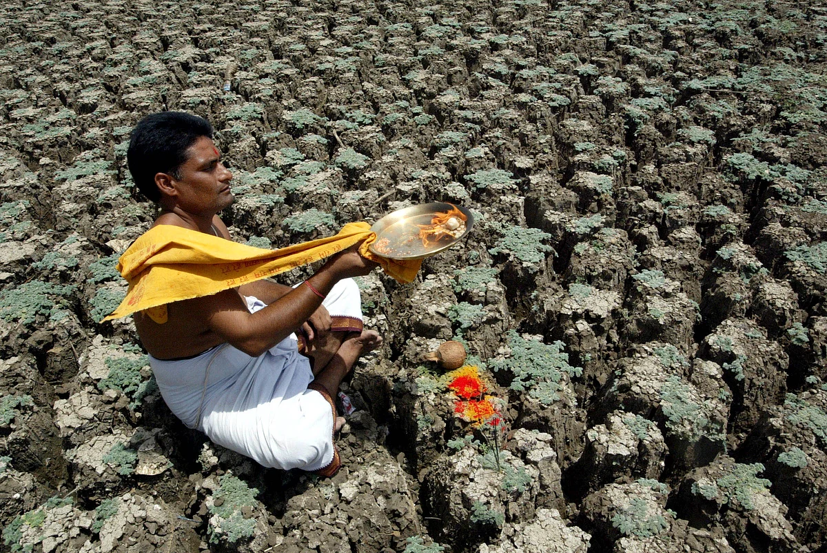 A priest performs rituals for monsoons to arrive early near Hyderabad. (Photo: Reuters)