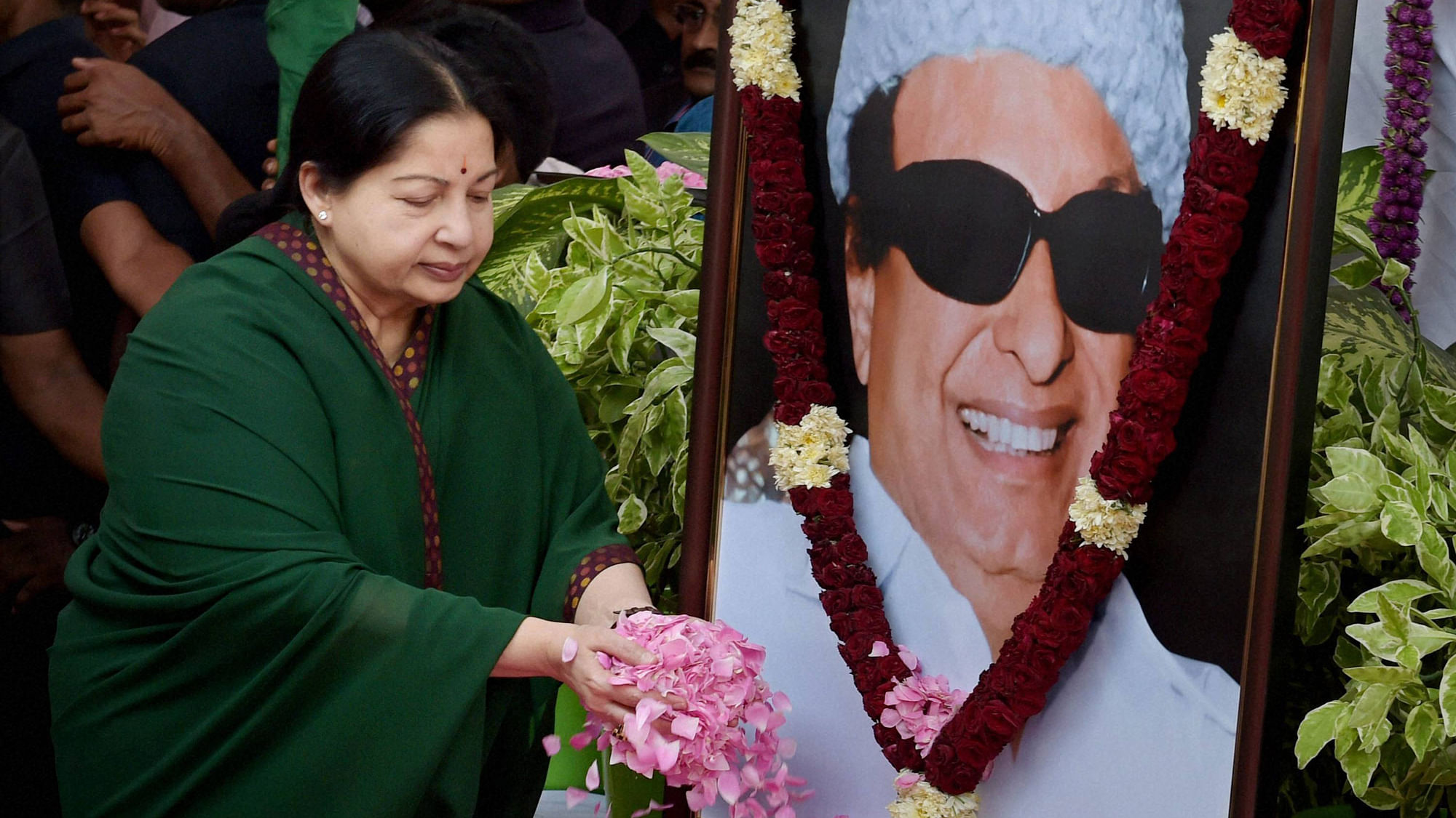 Jayalalithaa paying floral tribute to her mentor MGR in a file photo. (Photo: PTI)