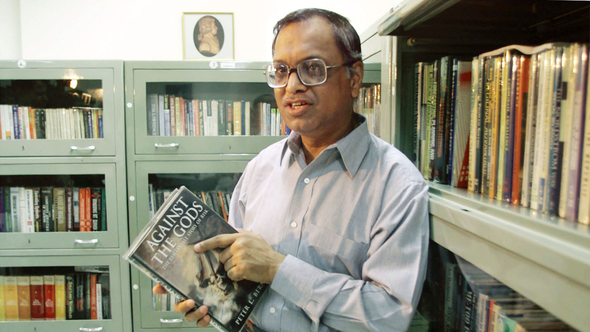 Narayana Murthy, Chairman and CEO of Infosys Technologies Ltd who says his only indulgences are books and music, stands in his office in Bangalore. (Photo: Reuters)