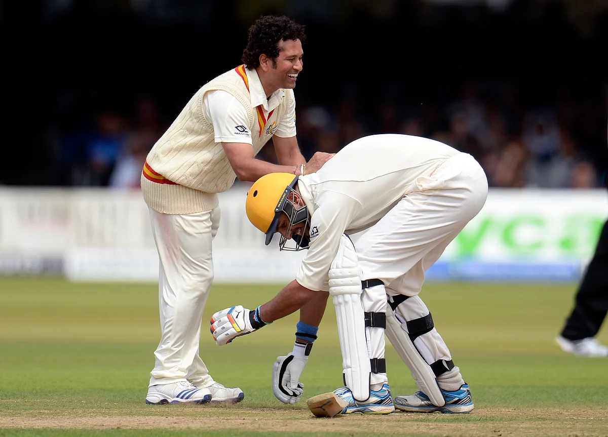 MCC’s captain Sachin Tendulkar smiles as Rest of the World’s Yuvraj Singh attempts to grab his leg during a cricket match to celebrate 200 years of Lord’s at Lord’s cricket ground in London. (Photo: Reuters)