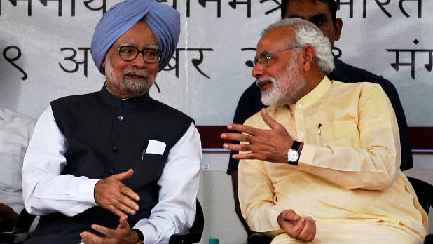 Former Prime Minister Manmohan Singh (left) with Prime Minister Narendra Modi (right), when he was the chief minister of Gujarat in Ahmedabad on 29 October  2013. (Photo: Reuters)