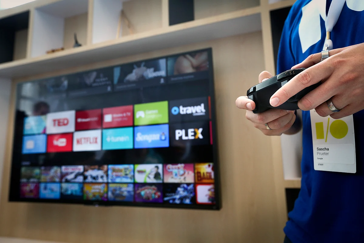A Google employee uses a game controller to demonstrate the features of the newly-announced Android TV. (Photo: Reuters)