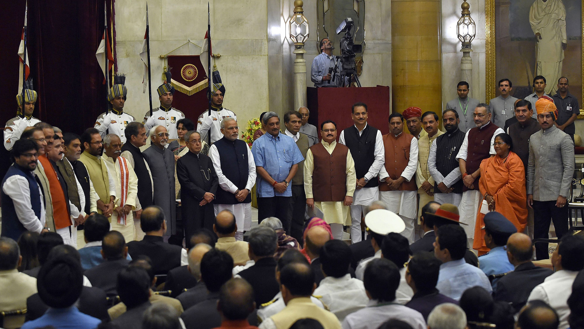 President Pranab Mukherjee and Prime Minister Narendra Modi pose with cabinet ministers after the swearing-in ceremony at the presidential palace in New Delhi, November, 2014. (Photo: Reuters)