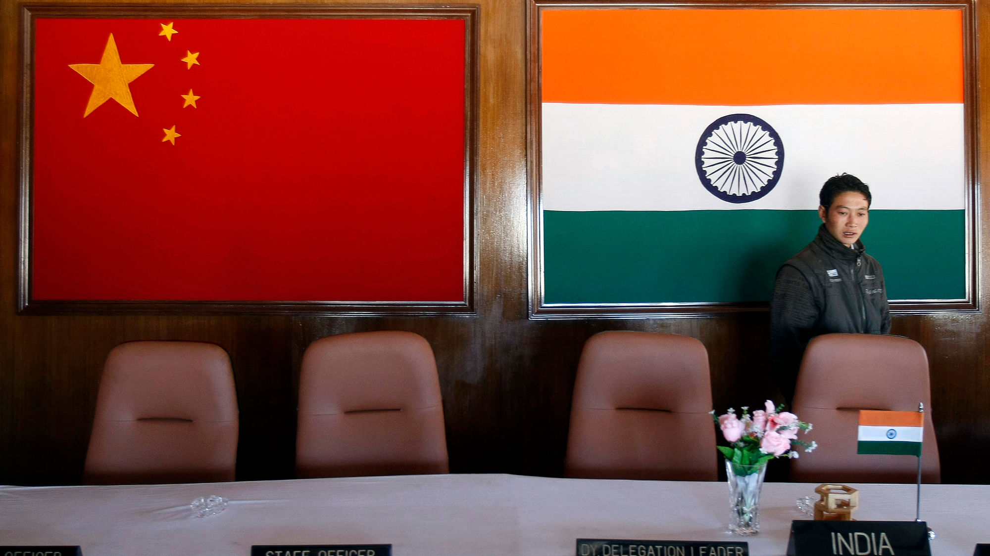 

<!--StartFragment-->A man walks inside a conference room used for meetings between military commanders of China and India, at the Indian side of the Indo-China border at Bumla, Arunachal Pradesh. (Photo: Reuters)&nbsp;<!--EndFragment-->