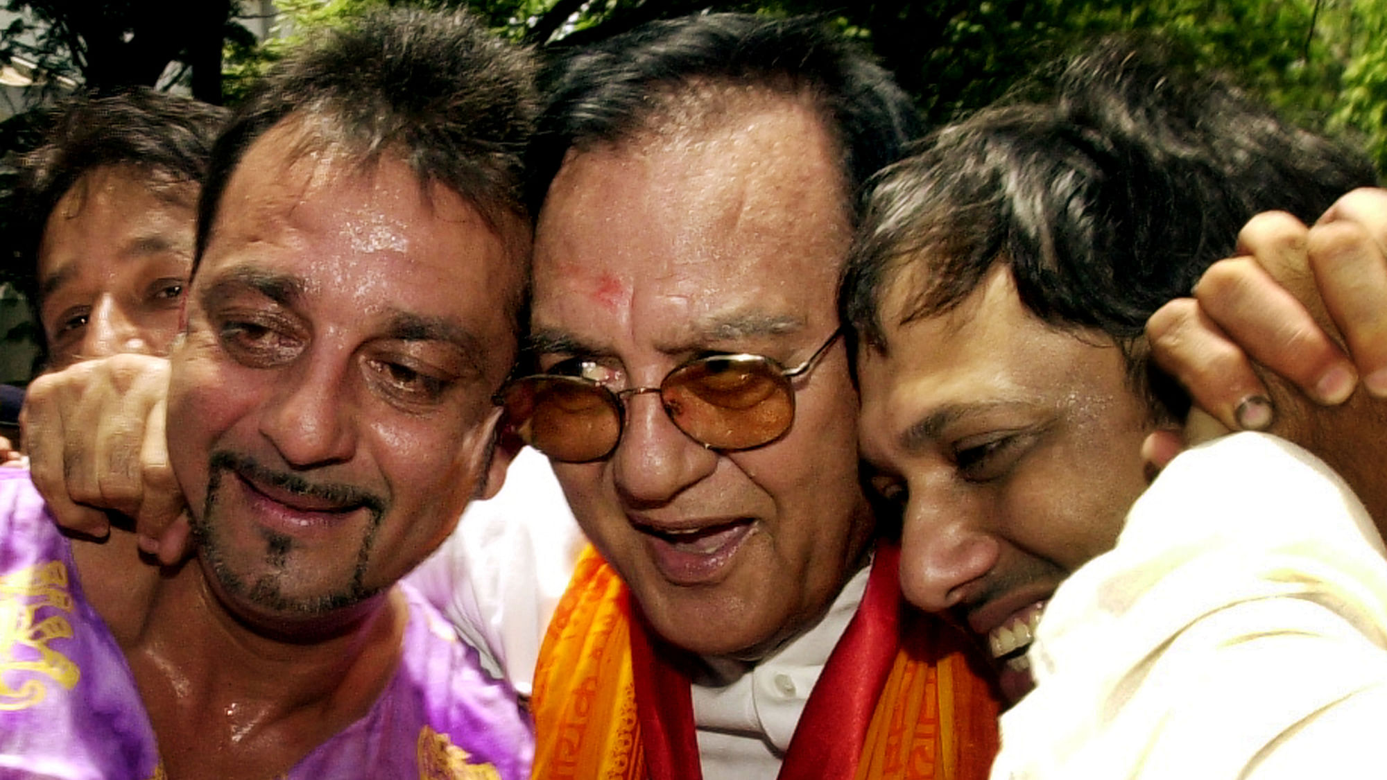 Bollywood legend Sunil Dutt flanked by son Sanjay Dutt (L) and Bollywood colleague Govinda (R) after the parliamentary elections, 2004.&nbsp;