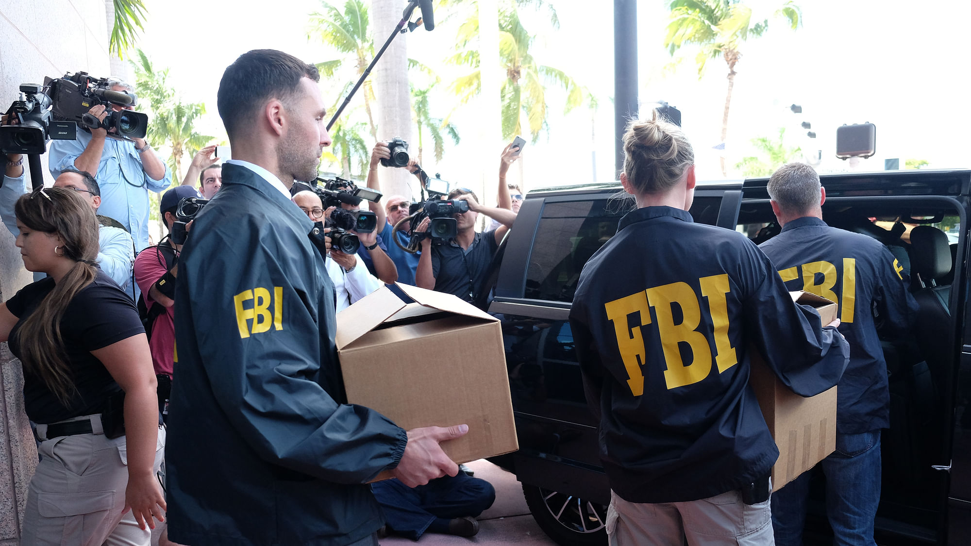 FBI agents carry boxes from the offices of CONCACAF, the soccer federation that governs North America, Central America and the Caribbean, in Miami Beach on Wednesday. (Photo: Reuters)