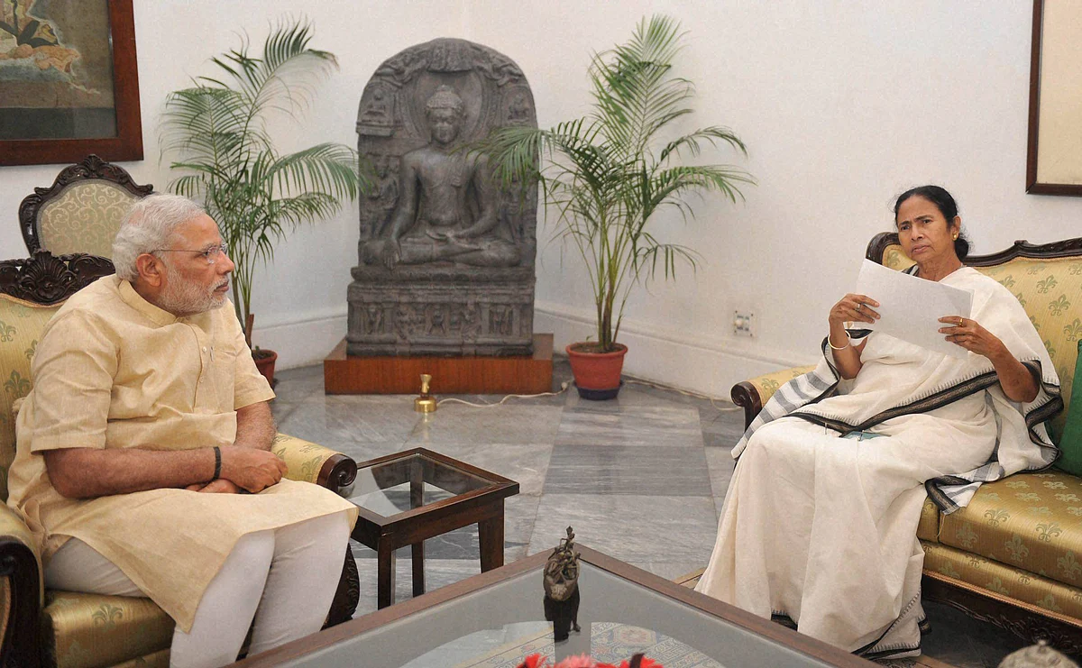 Prime Minister Narendra Modi meeting with Chief Minister of West Bengal, Mamata Banerjee at Raj Bhawan in Kolkata. (Photo: PTI)