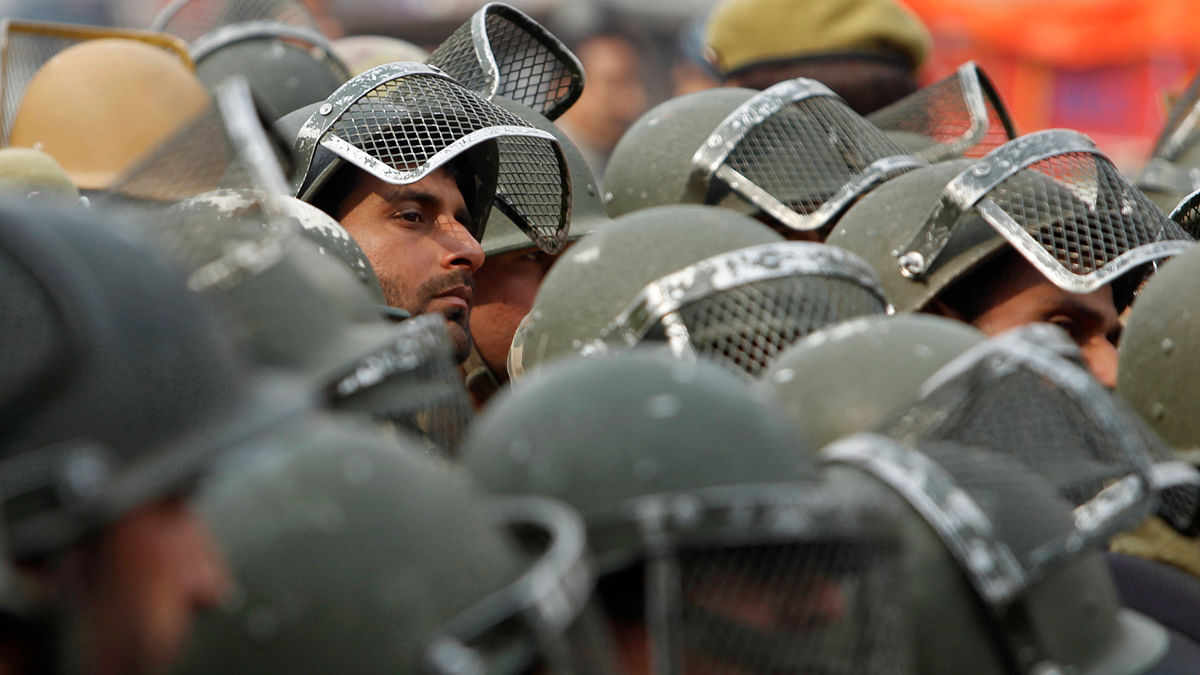 Policeman look on during a protest march against AFSPA. (Photo: Reuters)