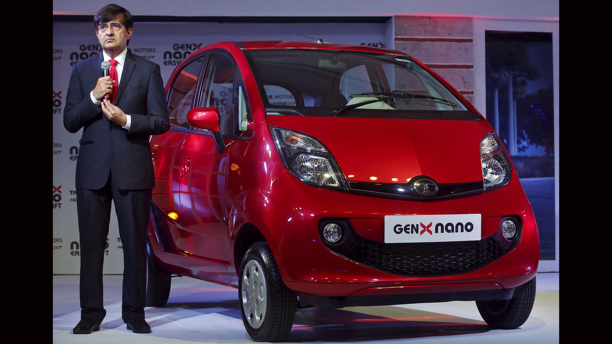 

<!--StartFragment-->Mayank Pareek, President of Tata Motors, listens to a question as he stands next to the company’s new GenX Nano&nbsp;car during its launch in Mumbai. (Photo: Reuters) <!--EndFragment-->