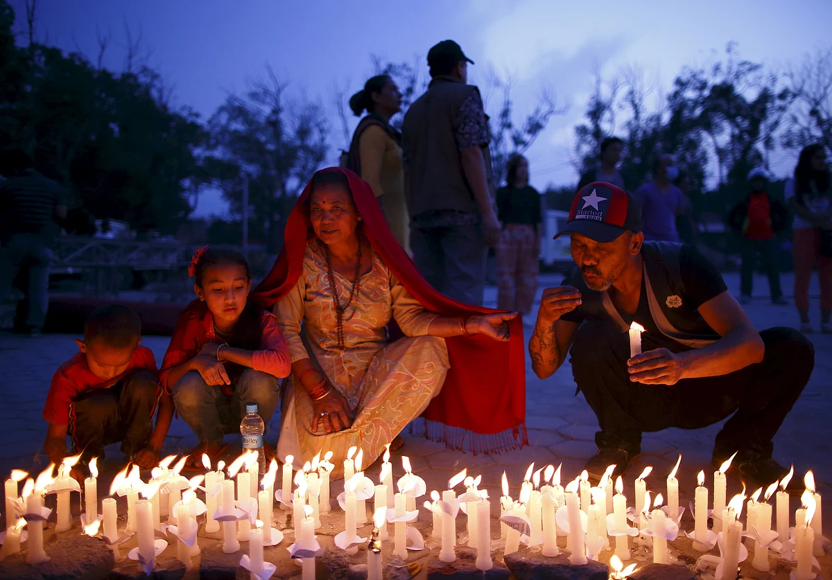 Nepalis take part in a candlelight vigil, a month after the April 25 earthquake in Kathmandu, Nepal. (Photo: Reuters)