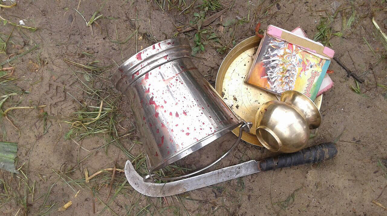 An assortment of items, including the machete, seized from the spot where a five-year-old boy was beheaded near a tea estate in Sonitpur district, Assam, on May 28. (Photo: Special Arrangement)