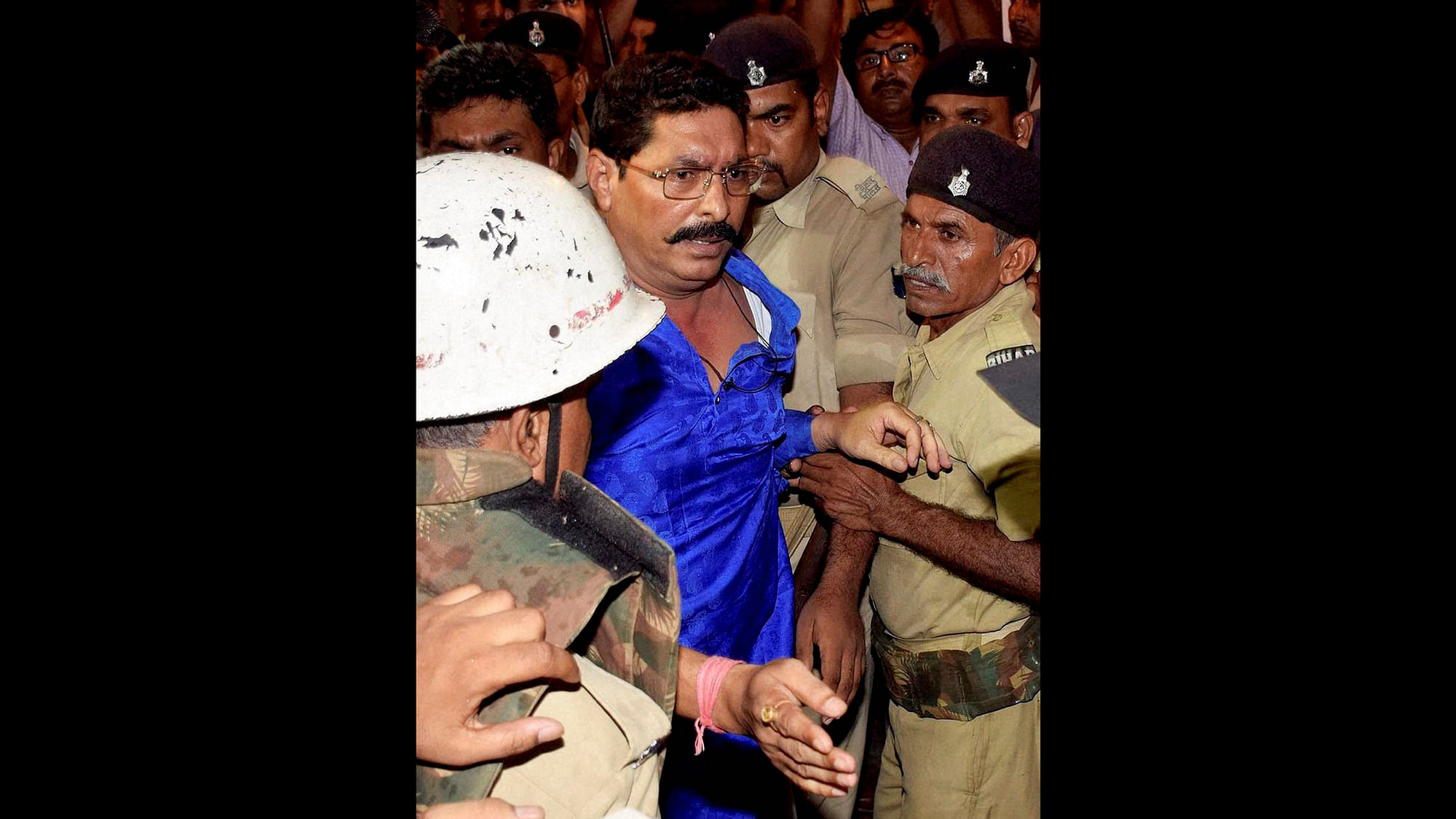 Anant Singh taken away by the police. (Photo: PTI)