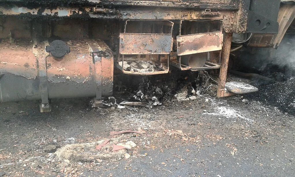 Charred remains of one of the Army trucks that caught fire in the ambush. (Photo ANI)