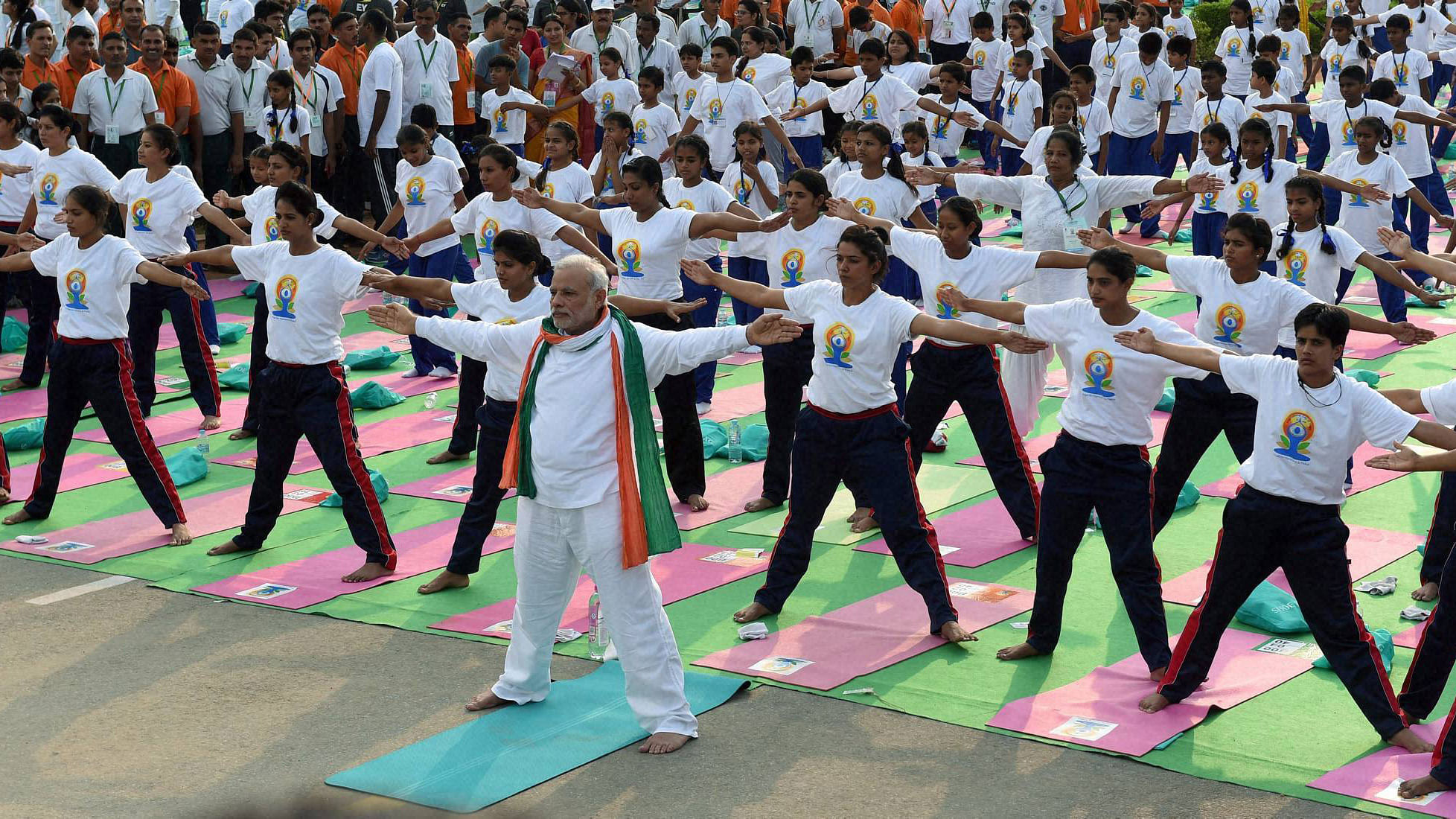 Prime Minister Narendra Modi performs yoga along with thousands of others at a mass yoga session to mark the International Day of Yoga 2015. (Photo: PTI)