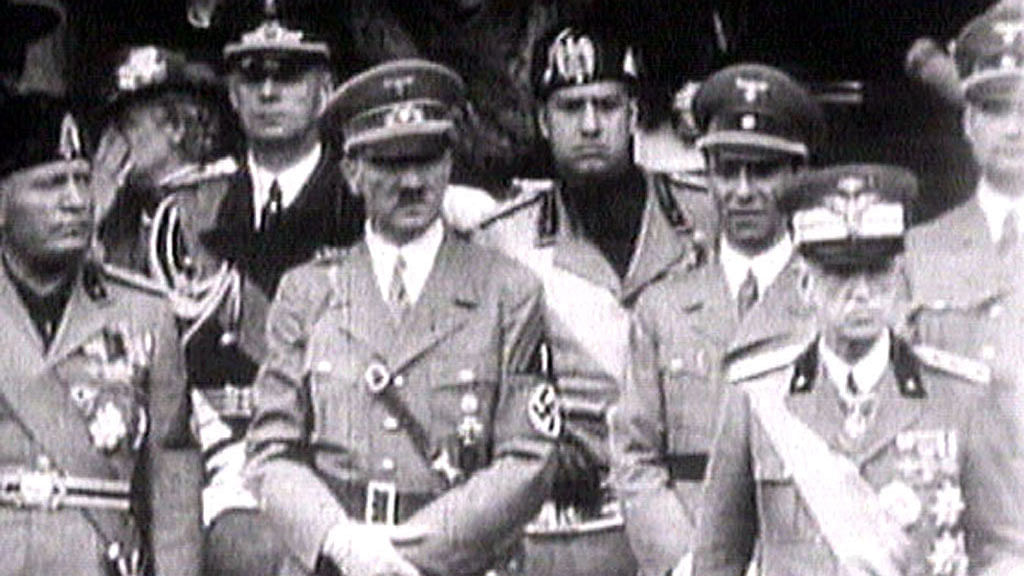 King Victor Emanuel III, (R) Adolf Hitler (C) and Benito Mussolini (L) watch fascist troops march past from a balcony in central Rome in this 1941 television file footage.(Photo: Reuters)
