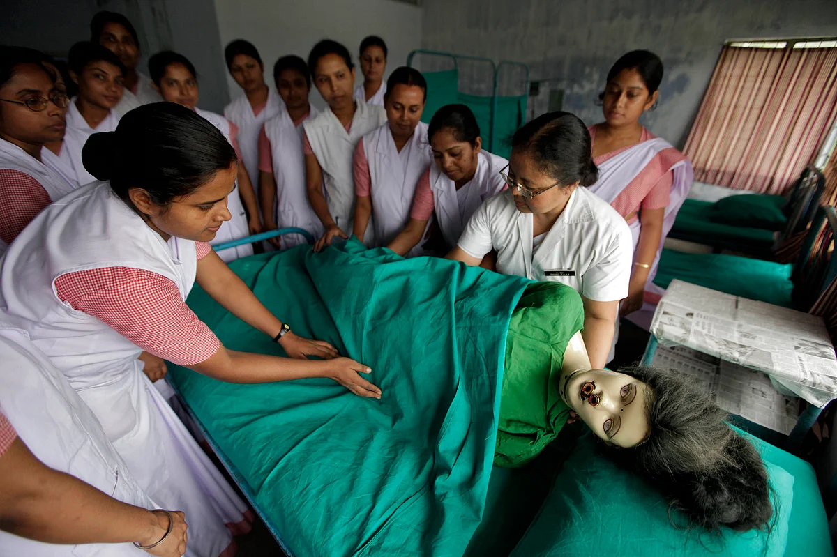 Students practise assisting a patient using a dummy during training inside a government medical college. (Photo: Reuters)