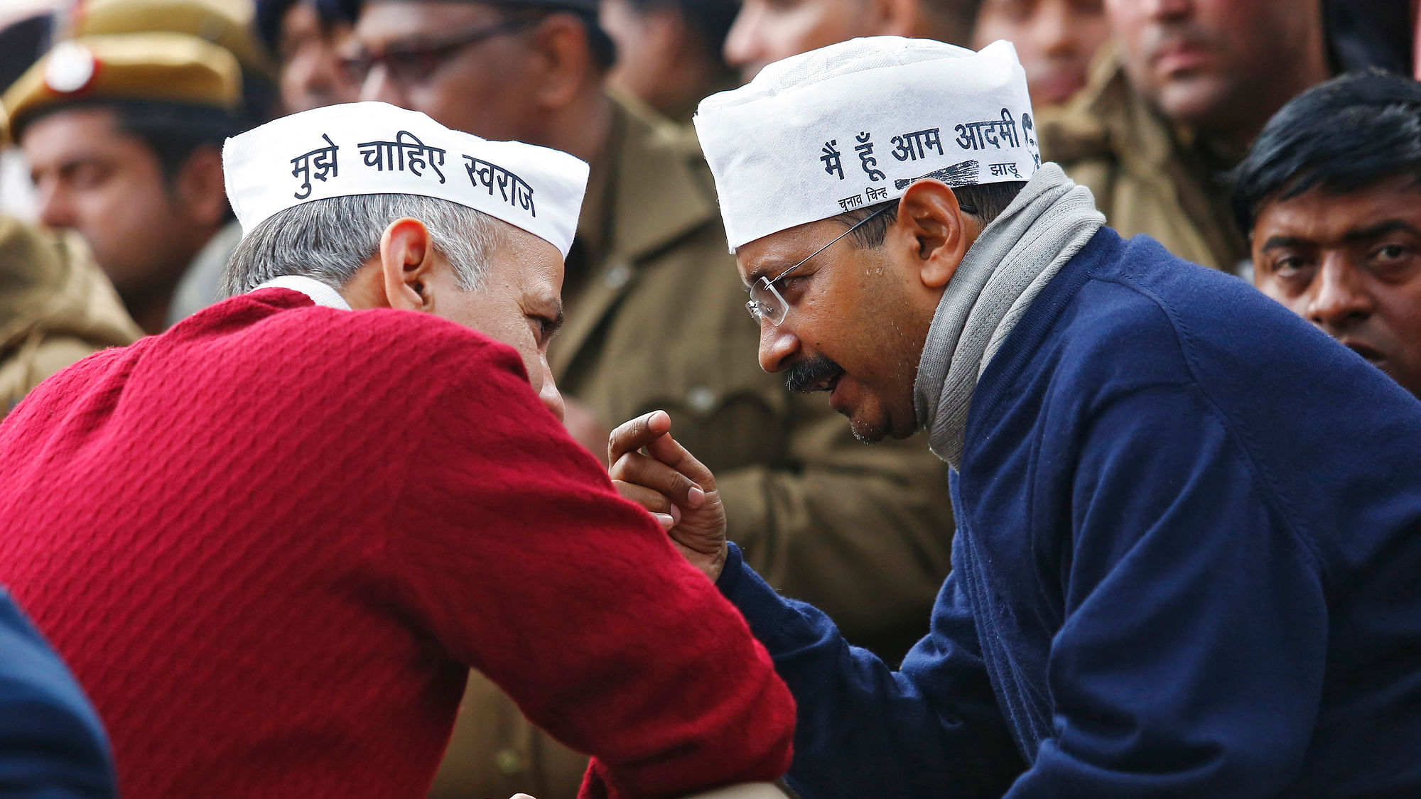 Delhi’s CM Arvind Kejriwal (R), leader of the Aam Aadmi Party (AAP), speaks with Delhi’s Education Minister Manish Sisodia during a protest in New Delhi. (Photo: Reuters)