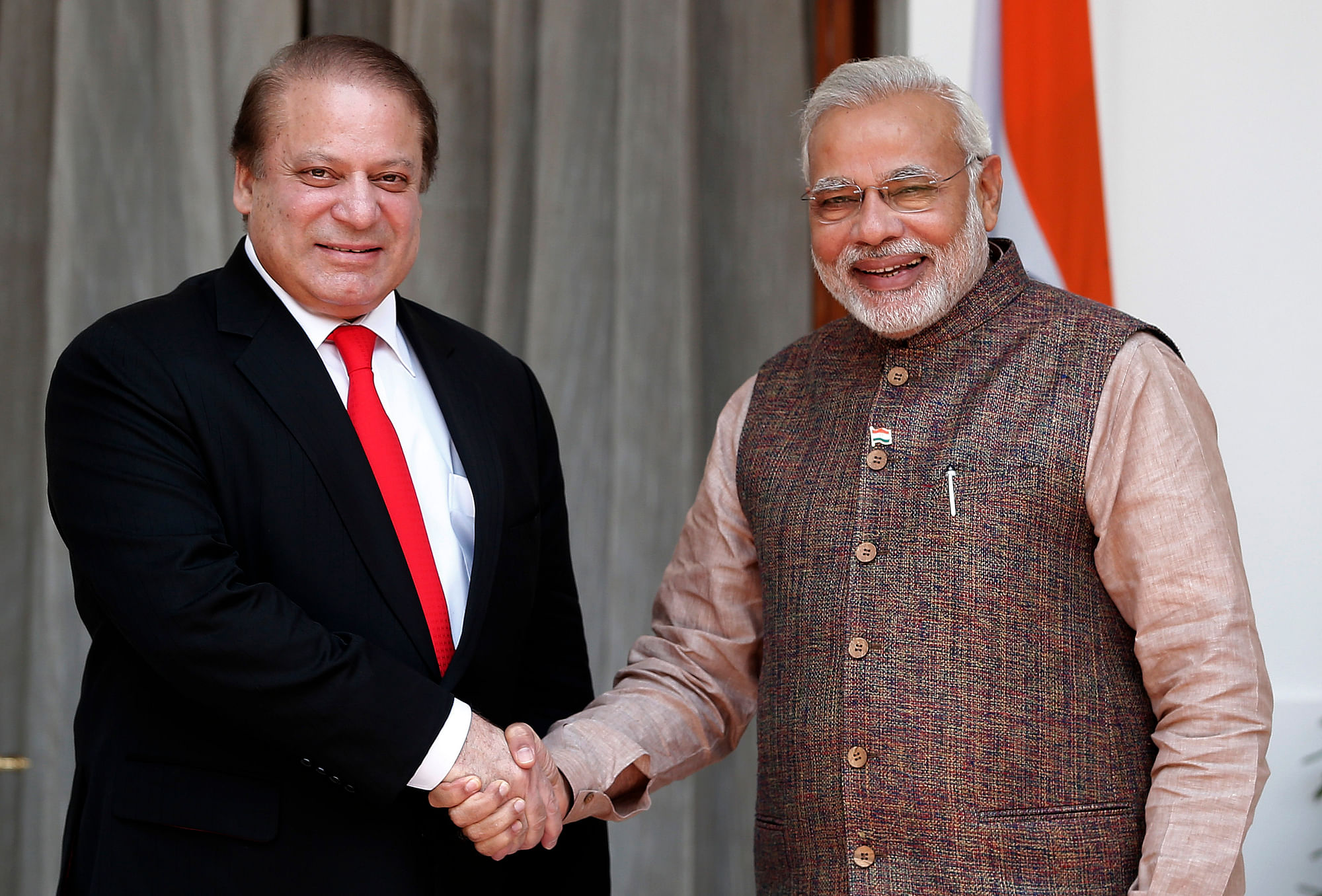 India’s Prime Minister Narendra Modi (R) shakes hands with his Pakistani counterpart Nawaz Sharif before the start of their bilateral meeting in New Delhi. (Photo: Reuters)&nbsp;