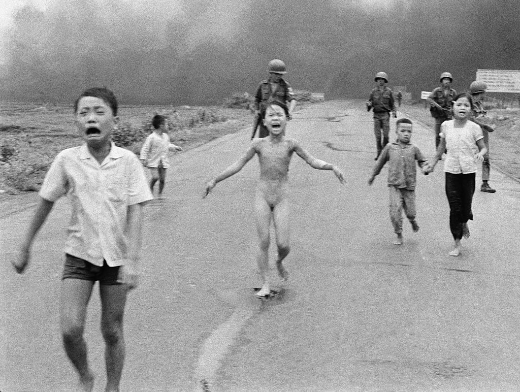 The iconic photo Nick Ut clicked 43 years ago in which a 9-year-old Kim Phuc (centre) is seen running among other children and South Vietnamese forces. (Photo: AP)