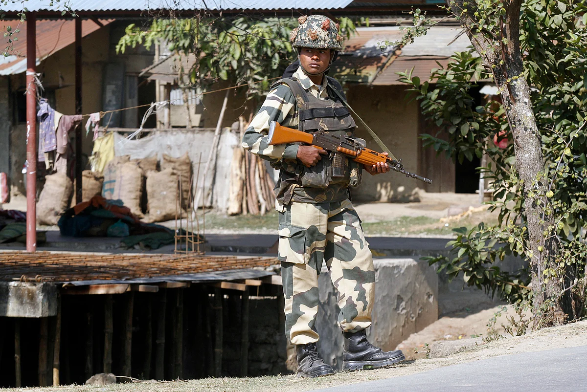 A member of the security forces stands guard along a roadside in Imphal. (Photo: Reuters) 