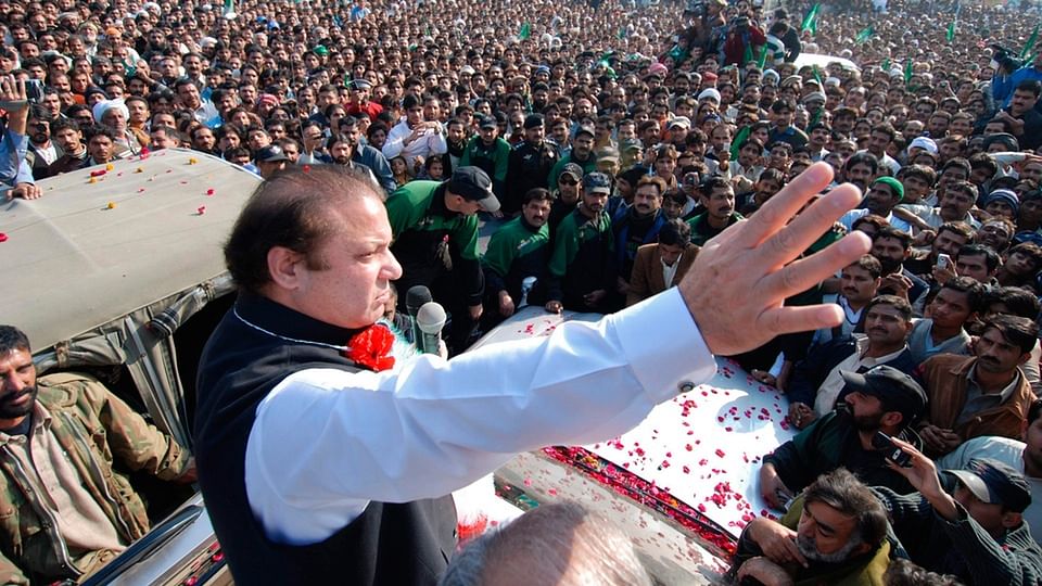 Pakistan Prime Minister Nawaz Sharif waves to his supporters.&nbsp;