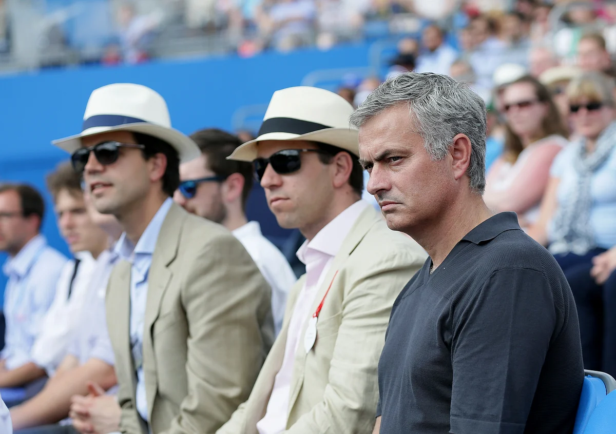 Chelsea soccer manager Jose Mourinho, right, watches the men’s singles tennis match between Spain’s Rafael Nadal and Ukraine’s Alexandr Dolgopolov at Queen’s tennis championship in London. (Photo: AP)