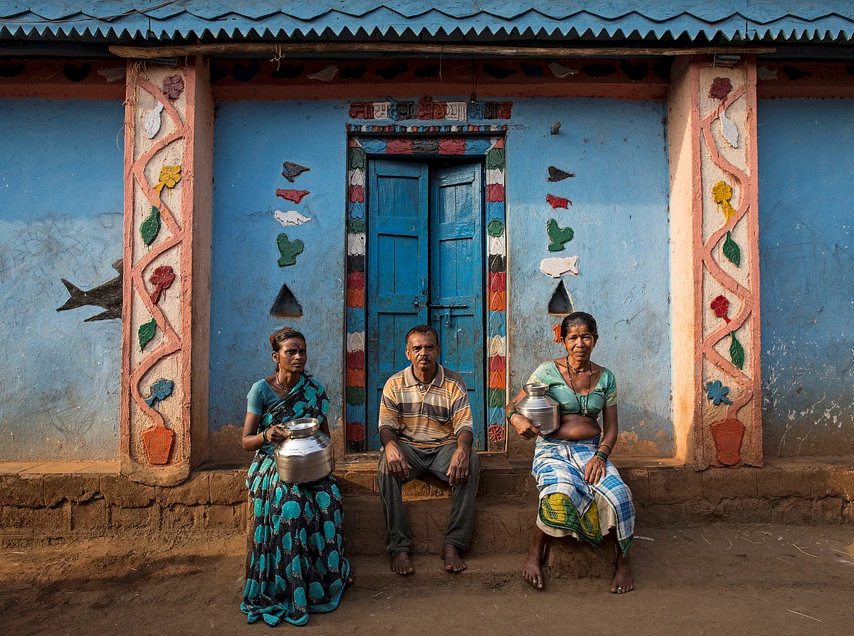 Namdeo poses with his wives Shivarti (L) and Bagabai (R) outside their house in Denganmal village, Maharashtra, India, April 21, 2015. (Photo: Reuters)