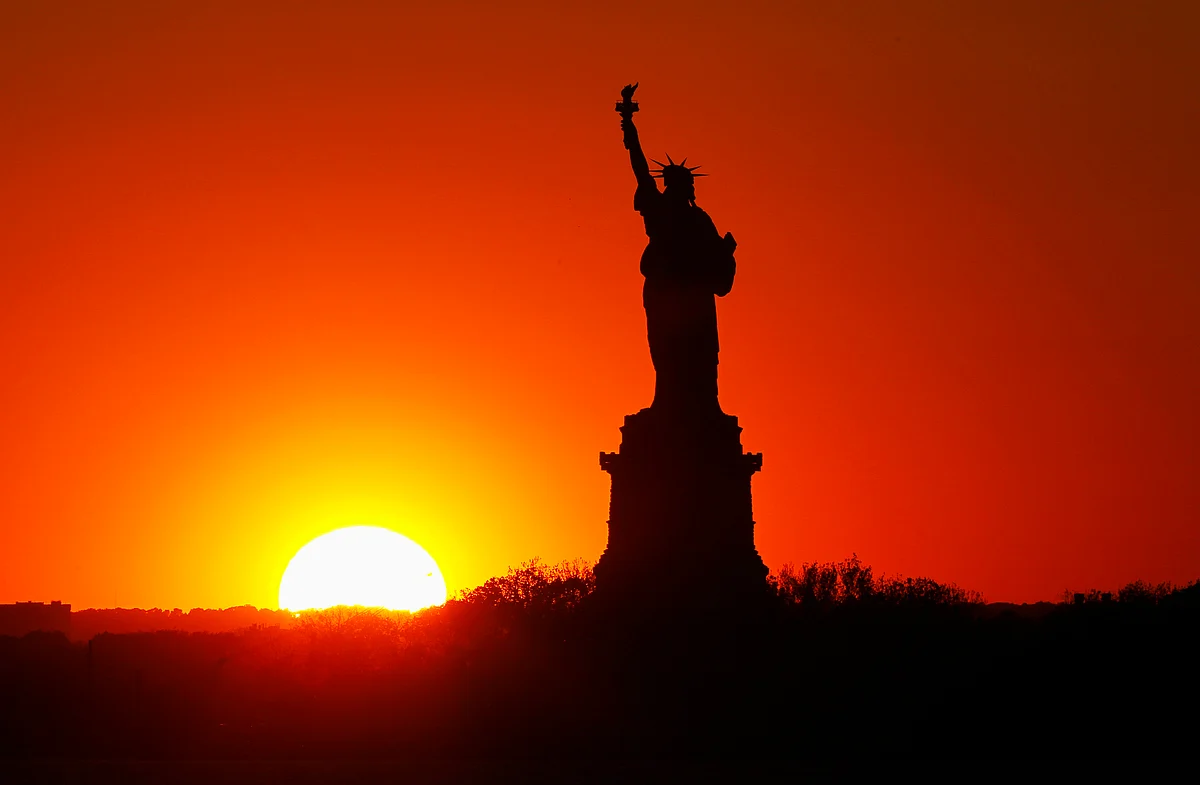 The imposing neoclassical statue with the sun setting in the background. (Photo: Reuters)