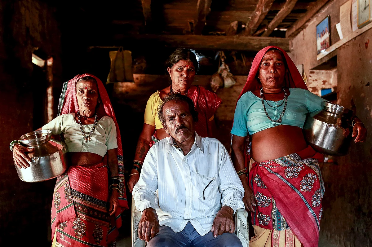Sakharam Bhagat, 66, poses with his wives, Sakhri, Tuki and Bhaagi (L to R) inside their house in Denganmal village, Maharashtra, India, April 20, 2015. (Photo: Reuters)